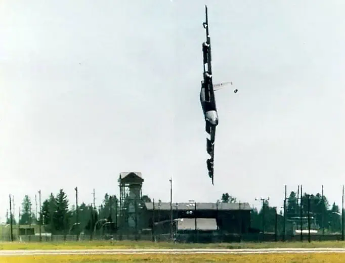 A B-52 bomber with the callsign CZAR52 is at an extreme bank angle close to 90 degrees.