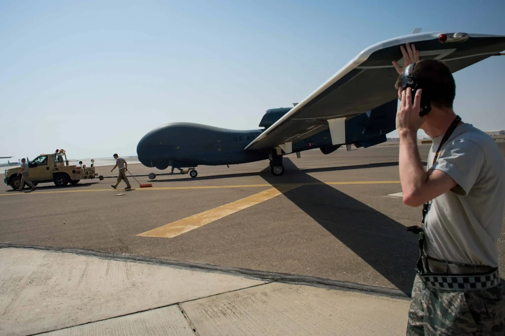 RQ-4 Global Hawk drone is being towed.